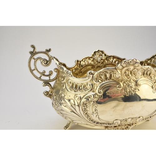 9 - A Victorian silver two handled dish, Albert Henry Thompson, Sheffield 1899, of oval form with emboss... 