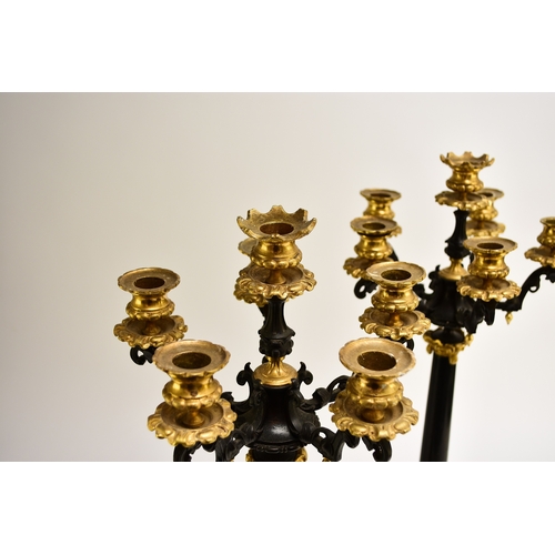 157 - A pair of bronze, ormolu and marble candelabra, late 19th century With five scroll branches having g... 