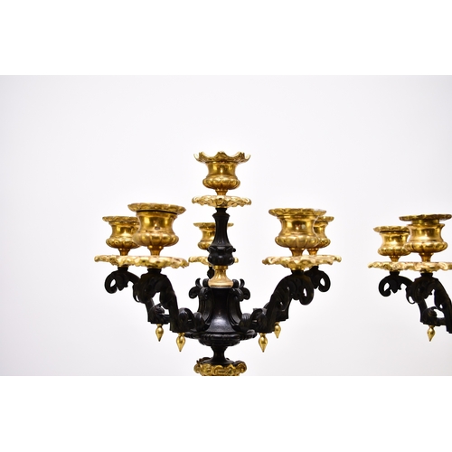 157 - A pair of bronze, ormolu and marble candelabra, late 19th century With five scroll branches having g... 