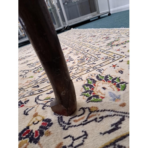 170 - A George III oak cross-banded dresser and rack The ogee cornice above four shelves, the lower flanke... 