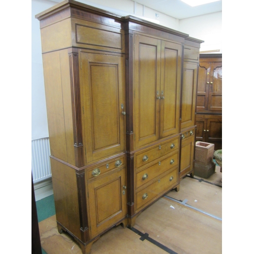 178 - A George III cross-banded oak break-front housekeeper's cupboard The reeded cornice above a mahogany... 