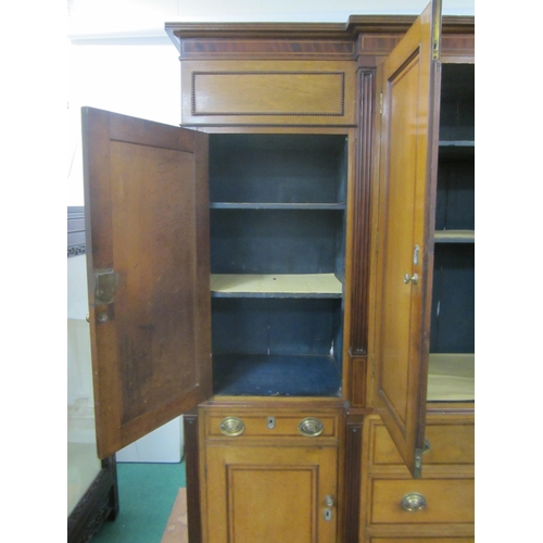 178 - A George III cross-banded oak break-front housekeeper's cupboard The reeded cornice above a mahogany... 