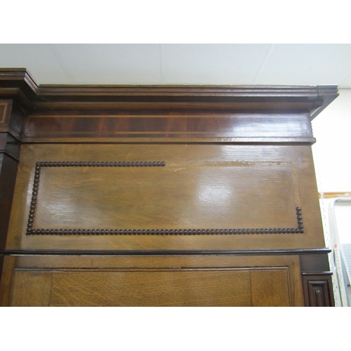 178 - A George III cross-banded oak break-front housekeeper's cupboard The reeded cornice above a mahogany... 