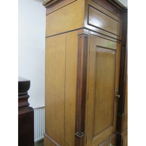 178 - A George III cross-banded oak break-front housekeeper's cupboard The reeded cornice above a mahogany... 