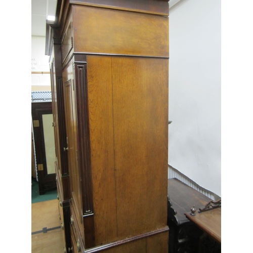 178 - A George III cross-banded oak break-front housekeeper's cupboard The reeded cornice above a mahogany... 
