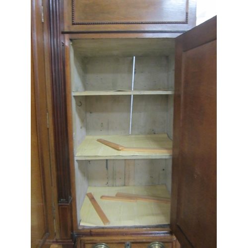 178 - A George III cross-banded oak break-front housekeeper's cupboard The reeded cornice above a mahogany... 