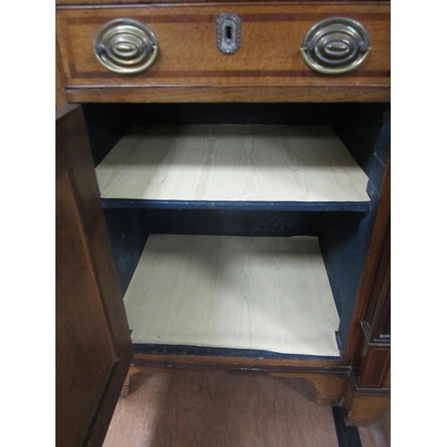 178 - A George III cross-banded oak break-front housekeeper's cupboard The reeded cornice above a mahogany... 