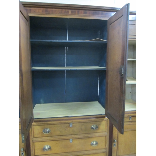 178 - A George III cross-banded oak break-front housekeeper's cupboard The reeded cornice above a mahogany... 