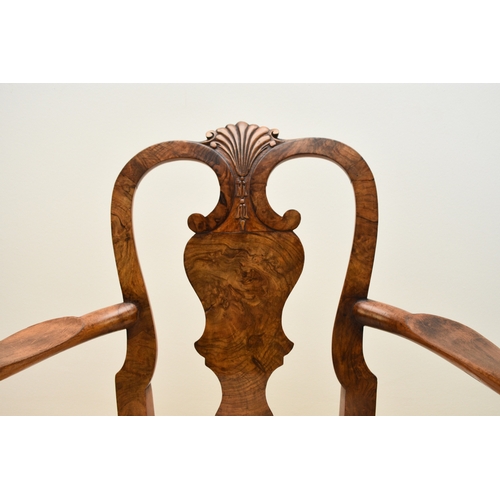 179 - A George I style walnut child's armchair With shaped splat and shell cresting, the shaped arms above... 