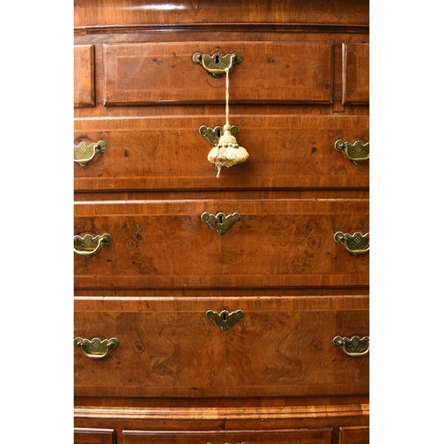 181 - A George II cross-banded and feather-banded walnut chest on stand The cavetto cornice above three sh... 