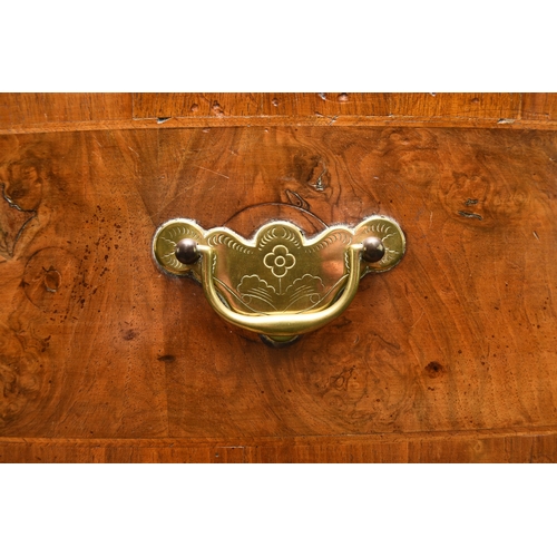 181 - A George II cross-banded and feather-banded walnut chest on stand The cavetto cornice above three sh... 