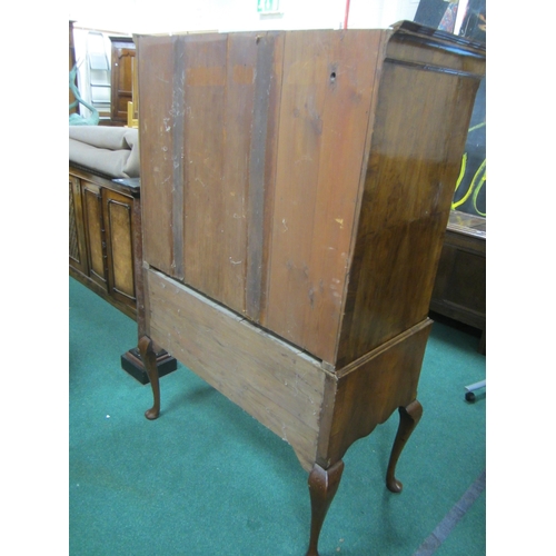 181 - A George II cross-banded and feather-banded walnut chest on stand The cavetto cornice above three sh... 