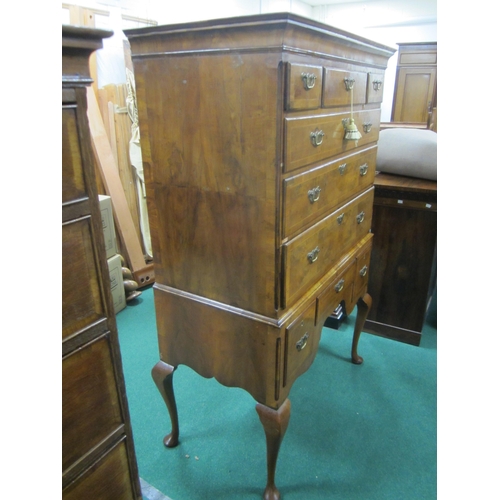 181 - A George II cross-banded and feather-banded walnut chest on stand The cavetto cornice above three sh... 
