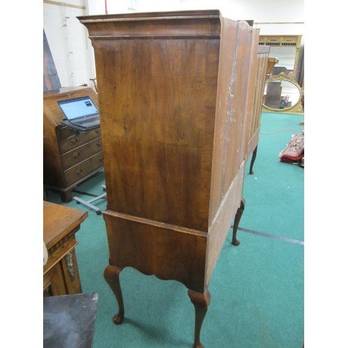 181 - A George II cross-banded and feather-banded walnut chest on stand The cavetto cornice above three sh... 