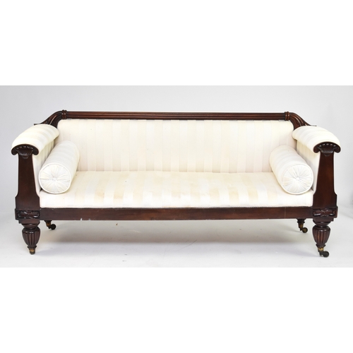 182 - A William IV mahogany upholstered sofa The reeded top rail with acanthus terminals, the scroll arms ... 