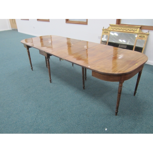 184 - A George III mahogany D-end extending dining table The top with reeded edge above a plain frieze, ra... 