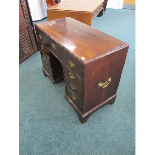 186 - A George III mahogany veneered campaign type kneehole desk The moulded top above a long frieze drawe... 