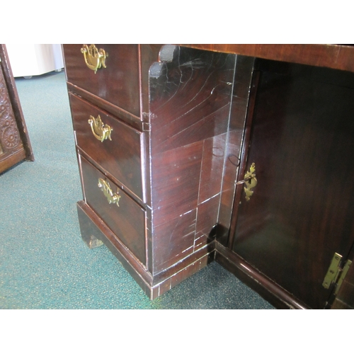 186 - A George III mahogany veneered campaign type kneehole desk The moulded top above a long frieze drawe... 