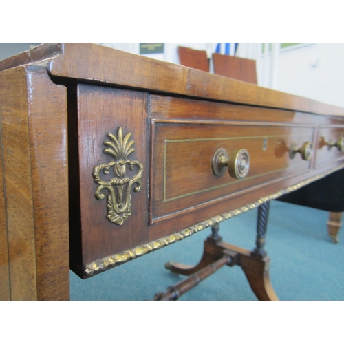 187 - A Regency brass inlaid rosewood sofa table The hinged rectangular top with rounded corners, fitted w... 