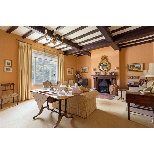 187 - A Regency brass inlaid rosewood sofa table The hinged rectangular top with rounded corners, fitted w... 