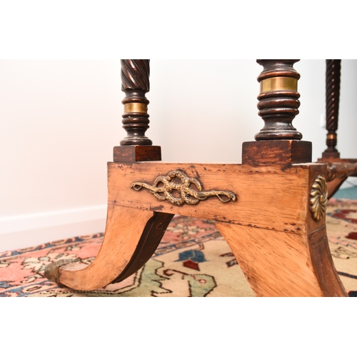 187 - A Regency brass inlaid rosewood sofa table The hinged rectangular top with rounded corners, fitted w... 