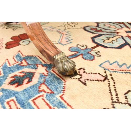 187 - A Regency brass inlaid rosewood sofa table The hinged rectangular top with rounded corners, fitted w... 