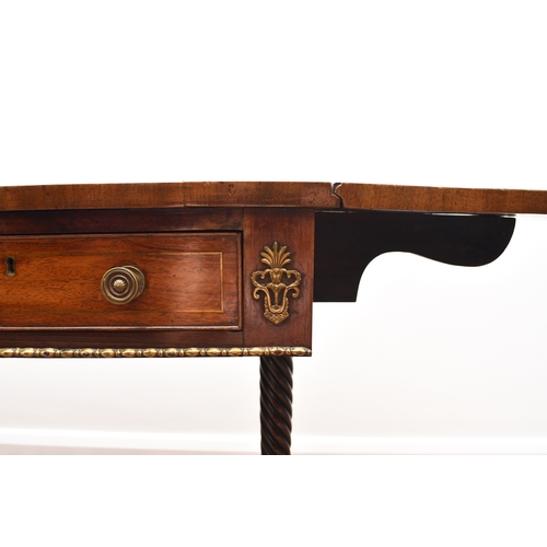 187 - A Regency brass inlaid rosewood sofa table The hinged rectangular top with rounded corners, fitted w... 