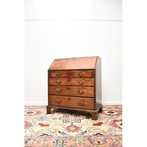 188 - A George III mahogany bureau The cross-banded fall front enclosing a fitted interior with six drawer... 