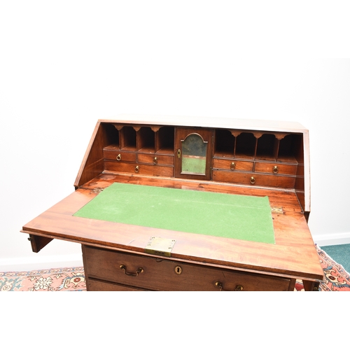 188 - A George III mahogany bureau The cross-banded fall front enclosing a fitted interior with six drawer... 