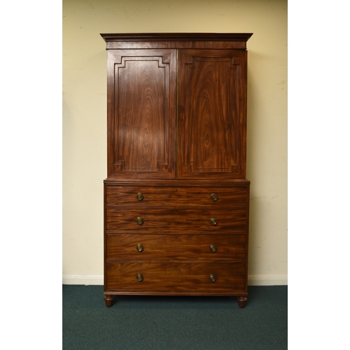 189 - A George III mahogany linen press The cavetto cornice above twin doors with fielded panels, enclosin... 