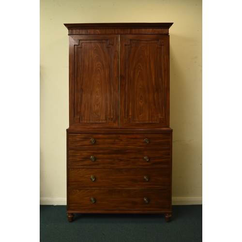 189 - A George III mahogany linen press The cavetto cornice above twin doors with fielded panels, enclosin... 