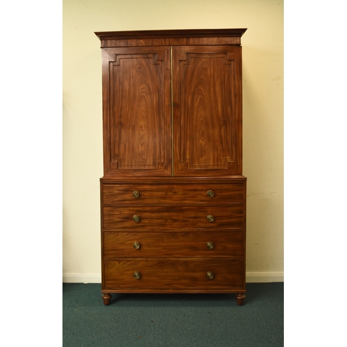 189 - A George III mahogany linen press The cavetto cornice above twin doors with fielded panels, enclosin... 