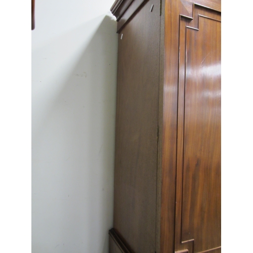 189 - A George III mahogany linen press The cavetto cornice above twin doors with fielded panels, enclosin... 