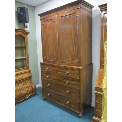 189 - A George III mahogany linen press The cavetto cornice above twin doors with fielded panels, enclosin... 