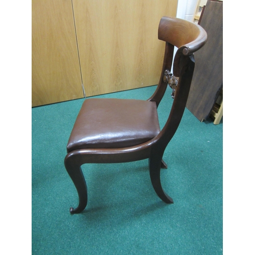 191 - A set of four William IV rosewood dining chairs The curved top rails with scroll ends above scroll a... 
