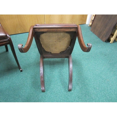 191 - A set of four William IV rosewood dining chairs The curved top rails with scroll ends above scroll a... 