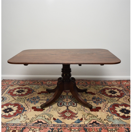 192 - A William IV mahogany tilt-top breakfast table The rectangular top with reeded edge, raised on a bal... 