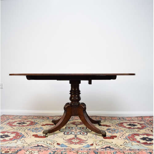 192 - A William IV mahogany tilt-top breakfast table The rectangular top with reeded edge, raised on a bal... 