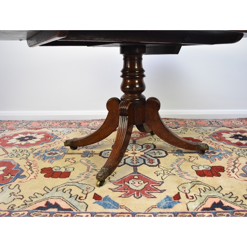 192 - A William IV mahogany tilt-top breakfast table The rectangular top with reeded edge, raised on a bal... 