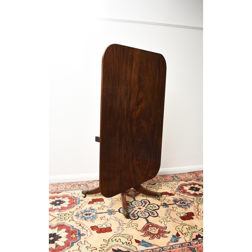 192 - A William IV mahogany tilt-top breakfast table The rectangular top with reeded edge, raised on a bal... 