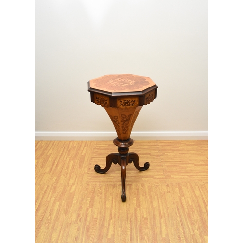 193 - A Victorian rosewood and marquetry inlaid work table The octagonal top inlaid with a bird within scr... 