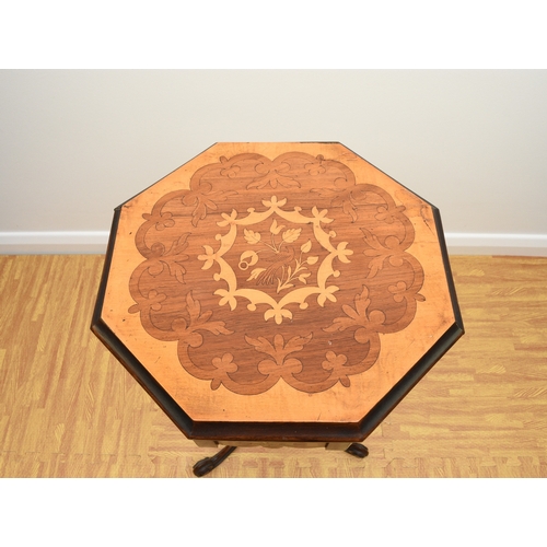193 - A Victorian rosewood and marquetry inlaid work table The octagonal top inlaid with a bird within scr... 
