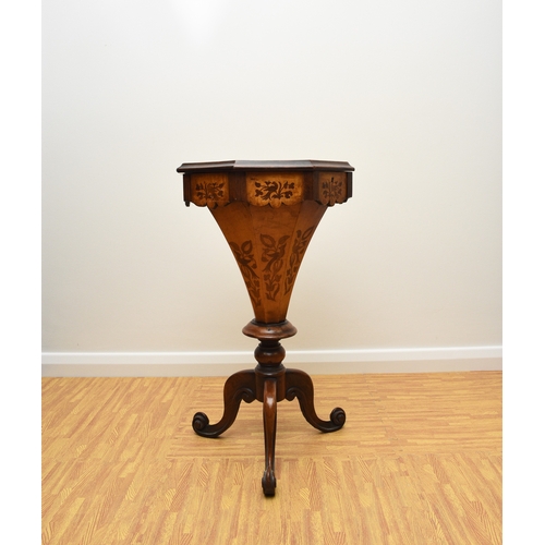 193 - A Victorian rosewood and marquetry inlaid work table The octagonal top inlaid with a bird within scr... 