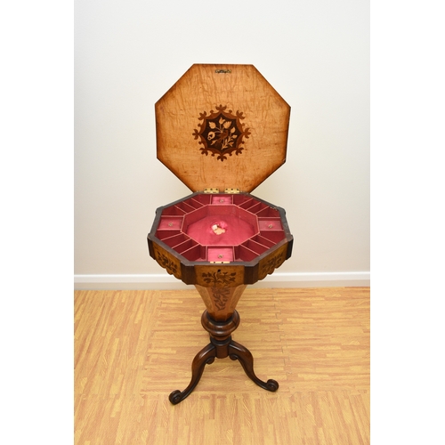 193 - A Victorian rosewood and marquetry inlaid work table The octagonal top inlaid with a bird within scr... 