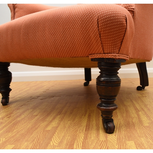 194 - Two 19th century upholstered wing armchairs The first of button back form, raised on turned mahogany... 
