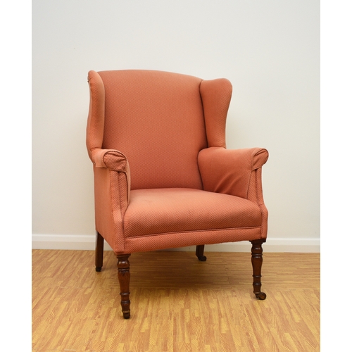 194 - Two 19th century upholstered wing armchairs The first of button back form, raised on turned mahogany... 