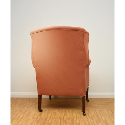 194 - Two 19th century upholstered wing armchairs The first of button back form, raised on turned mahogany... 