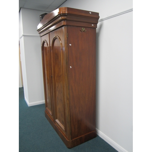 196 - A Victorian mahogany armoire The pedimented ogee cornice above twin arch-panelled doors, the interio... 