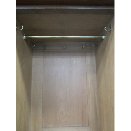 196 - A Victorian mahogany armoire The pedimented ogee cornice above twin arch-panelled doors, the interio... 