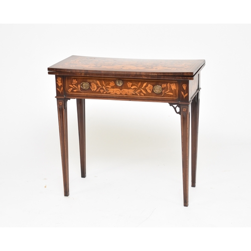 198 - A late 18th century Dutch marquetry card table The fold-over top inlaid with a flower filled urn and... 